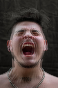 close up shot of a man screaming